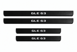 Catalog illustration of two front and two rear black Matte PRO door sill plates with GLE 63 lettering illuminated only on top; opaque unlit edges. Final dimensions selected for Mercedes-Benz GLE W167.