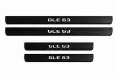 Catalog illustration of two front and two rear black Matte PRO door sill plates with GLE 63 lettering illuminated only on top; opaque unlit edges. Final dimensions selected for Mercedes-Benz GLE W167.