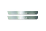 Two long silver-finished door sill plates with Meriva lettering on a light background, straight-on view.