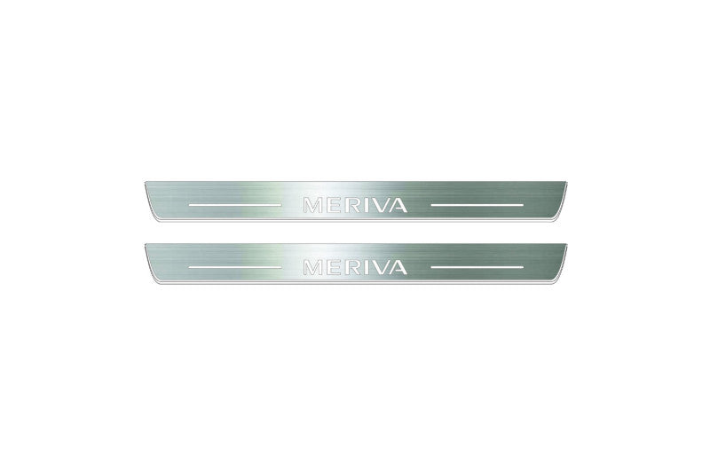 Two short silver-finished door sill plates with Meriva lettering on a light background, straight-on view.