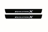 Catalogue illustration of two front black Matte PRO LED door sill plates with illuminated Evolution X lettering for Mitsubishi Lancer Evolution X; dimensions are selected during manufacture.