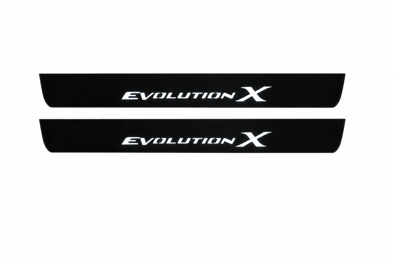 Catalogue illustration of two front black Matte PRO LED door sill plates with illuminated Evolution X lettering for Mitsubishi Lancer Evolution X; dimensions are selected during manufacture.