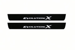 Catalogue illustration of two front black Matte PRO LED door sill plates with illuminated Evolution X lettering for Mitsubishi Lancer Evolution X; dimensions are selected during manufacture.