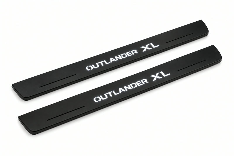 Catalogue illustration of two front black Matte PRO LED door sill plates with illuminated Outlander XL lettering for Mitsubishi Outlander; dimensions are selected during manufacture.