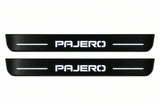 Catalogue illustration of two front black Matte PRO LED door sill plates with illuminated Pajero lettering for Mitsubishi Pajero Wagon V80; dimensions are selected during manufacture.