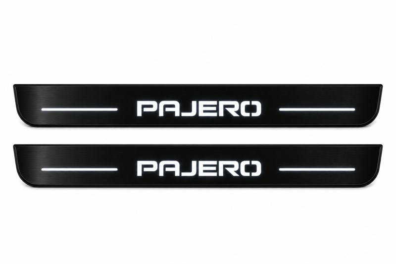 Catalogue illustration of two front black Matte PRO LED door sill plates with illuminated Pajero lettering for Mitsubishi Pajero Wagon V80; dimensions are selected during manufacture.