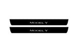 Tesla Model Y 2020+ illuminated entry guards in stainless steel with Model Y logo