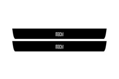 Catalog illustration of two black front door sill plates with MACH1 lettering.