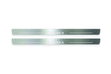 Two long silver-finished door sill plates with Navara lettering on a light background, straight-on view.