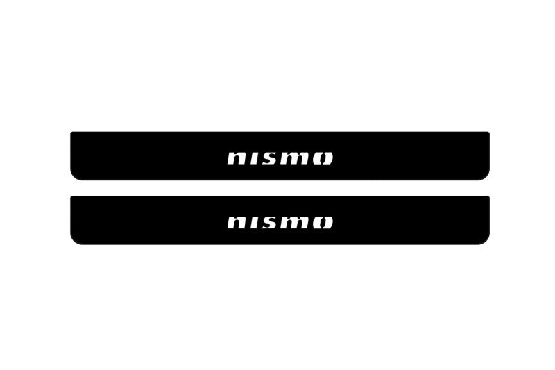 Nissan Armada II 2017+ illuminated door sill protectors in stainless steel with Nismo logo