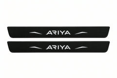 Catalogue illustration of two front black Matte PRO LED door sill plates with illuminated Ariya lettering for Nissan Ariya FE0; dimensions are selected during manufacture.