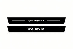 Catalogue illustration of two front black Matte PRO LED door sill plates with illuminated Qashqai +2 lettering for Nissan Qashqai I J10; dimensions are selected during manufacture.