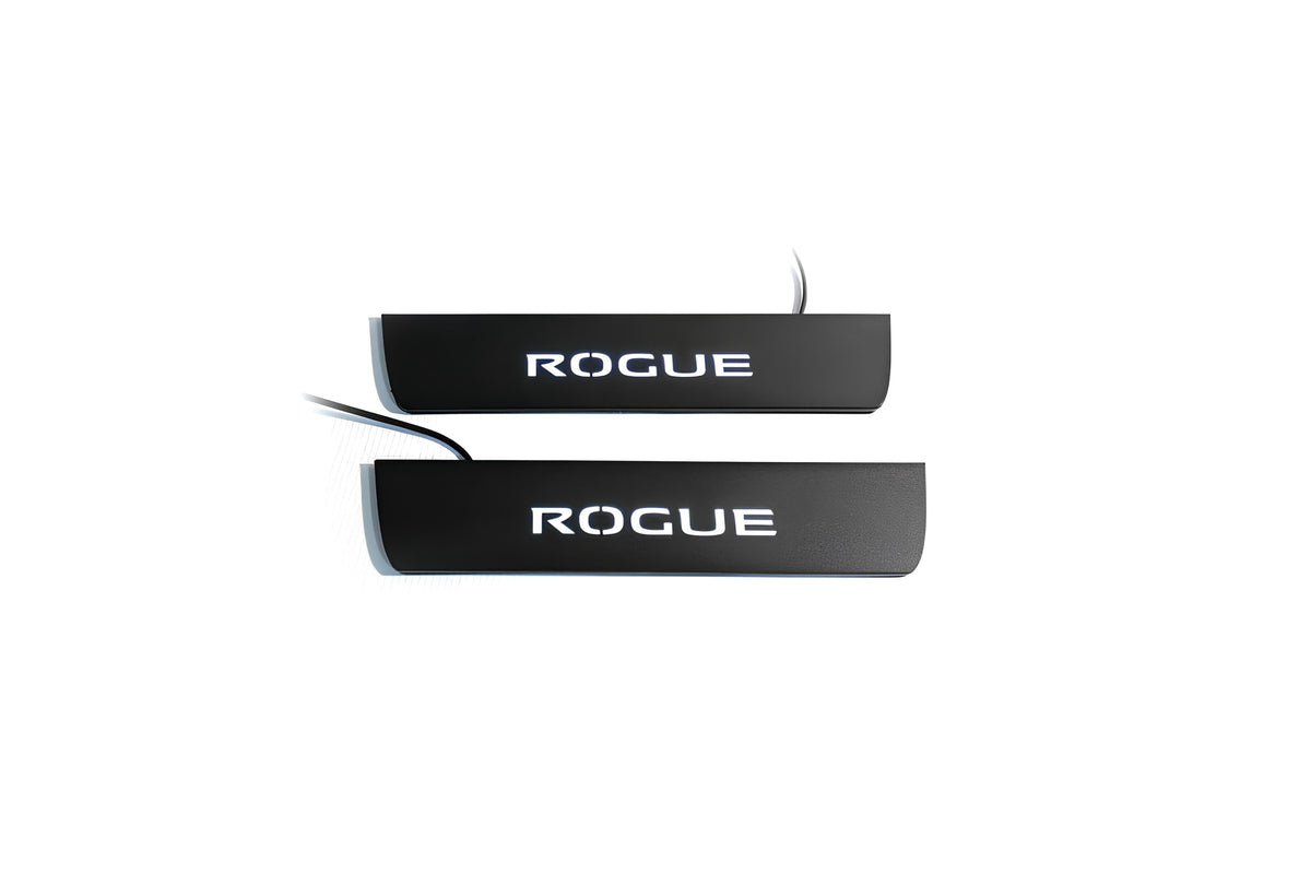 Two black door sill plates with white Rogue lettering and visible wiring on a light background.