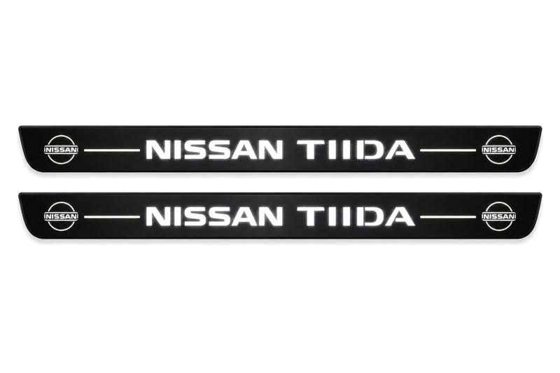 Catalogue illustration of two front black Matte PRO LED door sill plates with illuminated TIIDA lettering for Nissan Tiida C11; dimensions are selected during manufacture.