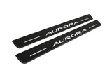 Matte PRO catalogue illustration showing two FRONT plates with illuminated Aurora lettering on a white background; Oldsmobile Aurora I dimensions are selected during manufacture; rear plates are not pictured.