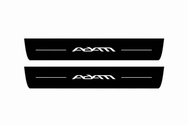 Catalogue illustration of two front black Matte PRO LED door sill plates with illuminated Adam lettering for Opel Adam M13; dimensions are selected during manufacture.