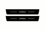 Catalogue illustration of two front black Matte PRO LED door sill plates with illuminated Corsa lettering for Opel Corsa E 5-door Hatchback X15; dimensions are selected during manufacture.