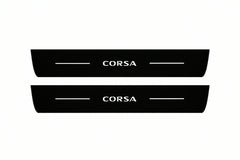 Catalogue illustration of two front black Matte PRO LED door sill plates with illuminated Corsa lettering for Opel Corsa F; dimensions are selected during manufacture.