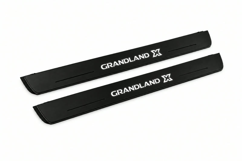 Catalogue illustration of two front black Matte PRO LED door sill plates with illuminated Grandland X lettering for Opel Grandland X; dimensions are selected during manufacture.
