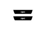 Catalog illustration of two black rear door sill plates with OPC lettering.