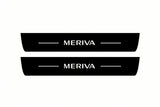 Catalogue illustration of two front black Matte PRO LED door sill plates with illuminated Meriva lettering for Opel Meriva A; dimensions are selected during manufacture.