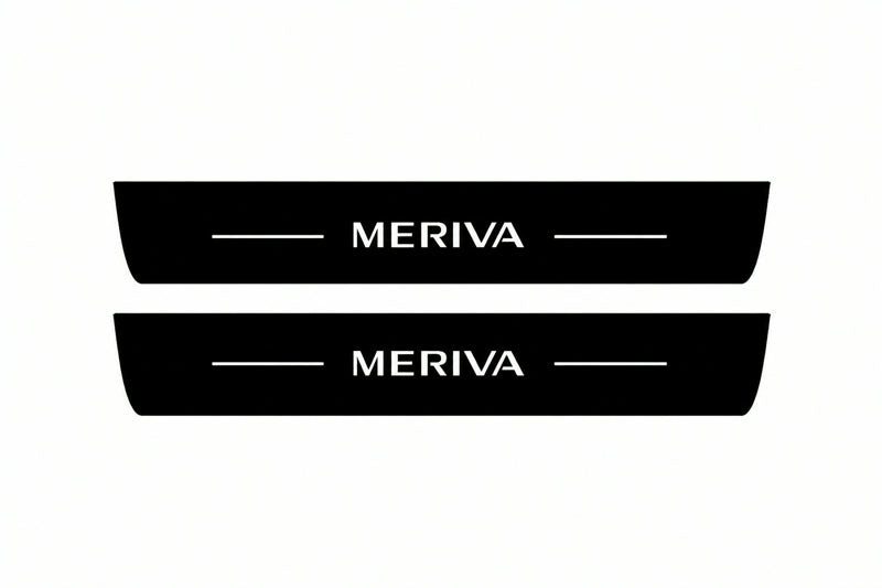 Catalogue illustration of two front black Matte PRO LED door sill plates with illuminated Meriva lettering for Opel Meriva A; dimensions are selected during manufacture.