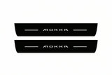 Catalogue illustration of two front black Matte PRO LED door sill plates with illuminated Mokka lettering for Opel Mokka II; dimensions are selected during manufacture.