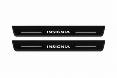 Catalogue illustration of two front black Matte PRO LED door sill plates with illuminated Vauxhall Insignia lettering for Opel / Vauxhall Insignia Sports Tourer Z18; the FRONT+REAR option includes rear plates not shown; final dimensions are selected during manufacture.