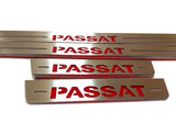 Close-up of bold red Passat lettering and horizontal slots on long and short silver-finished door sill plates.