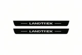 Catalogue illustration of two front black Matte PRO LED door sill plates with illuminated Landtrek lettering for Peugeot Landtrek; dimensions are selected during manufacture.