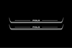 Two long door sill plates with Polo lettering and edges illuminated in white, straight-on view on a dark background.