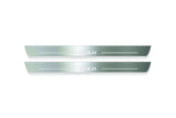 Two long silver-finished door sill plates with Polo lettering on a light background, straight-on view.