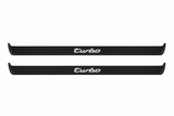 Catalogue illustration of two black Matte PRO front sill plates with illuminated cursive turbo lettering on top. Side edges remain unlit; no rear plates or exact dimensions pictured.