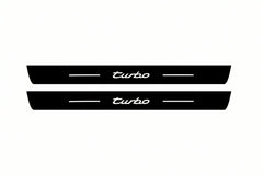 Catalogue illustration of two front black Matte PRO LED door sill plates with illuminated Turbo lettering for Porsche Cayenne 92A; dimensions are selected during manufacture.