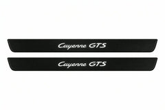 Catalogue illustration of two front black Matte PRO LED door sill plates with illuminated Cayenne GTS lettering for Porsche Cayenne 9Y0; dimensions are selected during manufacture.