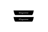 Catalog illustration of two black rear door sill plates with Cayenne lettering.
