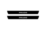 Toyota Prado 250 2023+ illuminated entry guards in matte black coated stainless steel with Prado logo