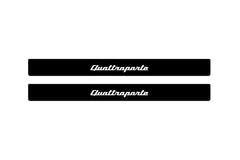 Catalog illustration of two black front door sill plates with Quattroporte lettering.