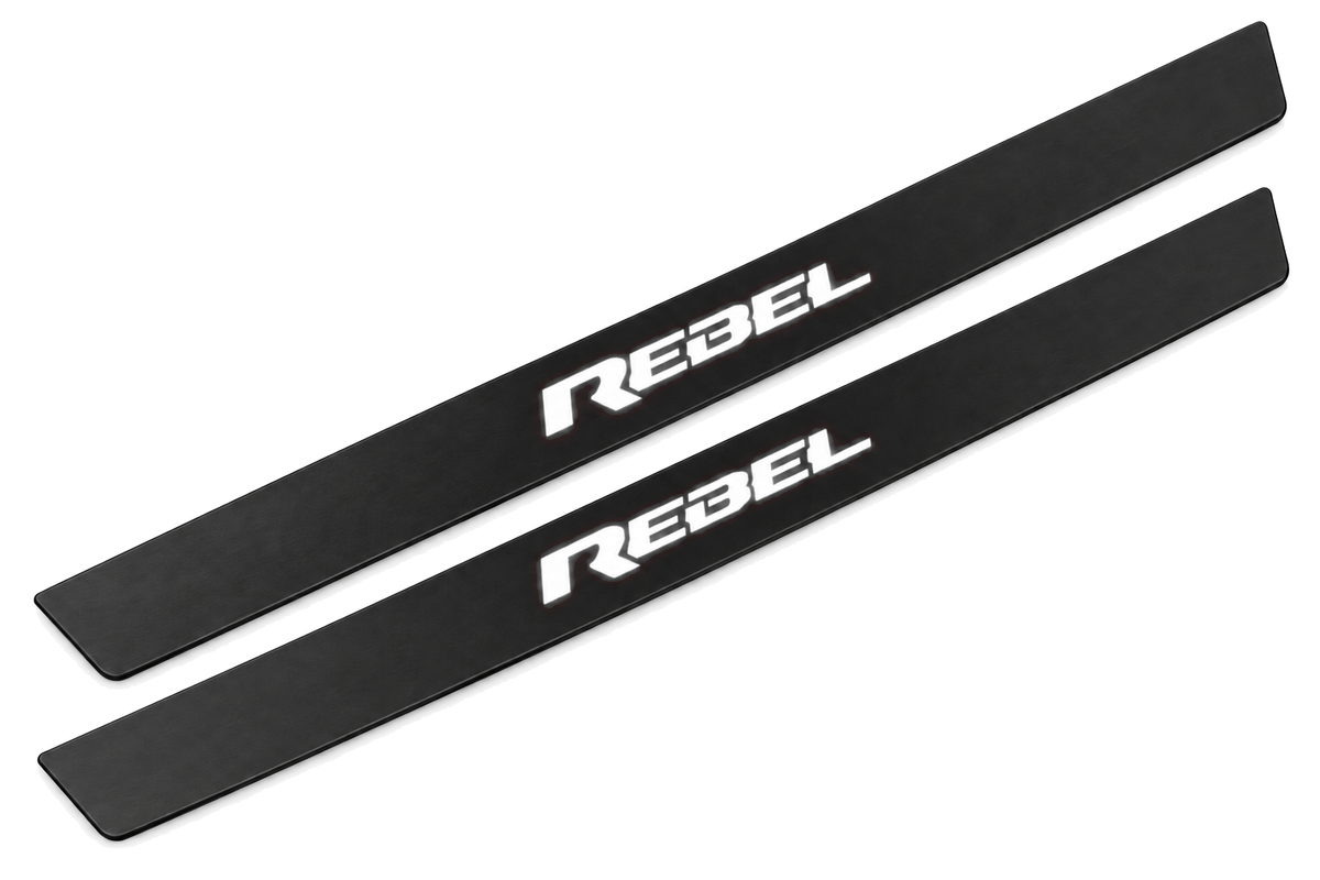 Matte PRO catalogue illustration showing two FRONT plates with illuminated REBEL lettering on a white background; Ram 1500 DT dimensions are selected during manufacture; rear plates are not pictured.