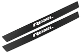 Matte PRO catalogue illustration showing two FRONT plates with illuminated REBEL lettering on a white background; Ram 1500 DT dimensions are selected during manufacture; rear plates are not pictured.
