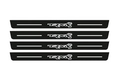 Catalogue illustration of two front and two rear black Matte PRO LED door sill plates with illuminated TRX Dinosaur design for Ram 1500 DT; dimensions are selected during manufacture.