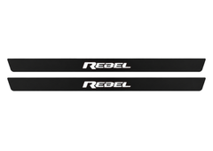 Matte PRO catalogue illustration showing two FRONT plates with illuminated REBEL lettering on a white background; RAM 2500 V dimensions are selected during manufacture; rear plates are not pictured.