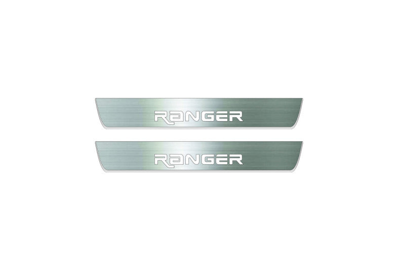 Two short silver-finished door sill plates with Ranger in angular lettering lettering on a light background, straight-on view.