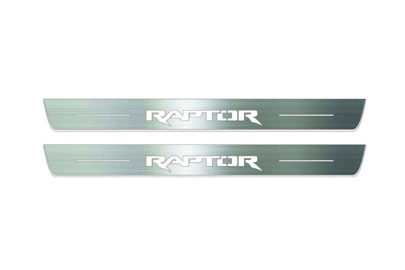 Two long silver-finished door sill plates with Raptor lettering on a light background, straight-on view.