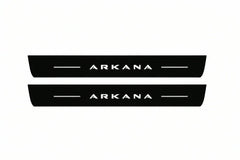 Catalogue illustration of two front black Matte PRO LED door sill plates with illuminated Arkana lettering for Renault Arkana; dimensions are selected during manufacture.