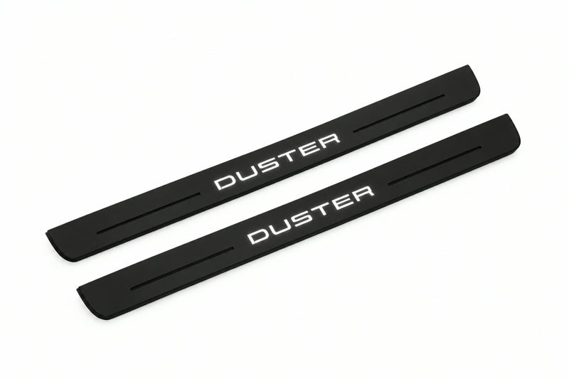 Catalogue illustration of two front black Matte PRO LED door sill plates with illuminated Duster lettering for Renault Duster P1310; dimensions are selected during manufacture.