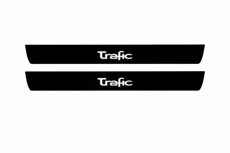 Catalogue illustration of two front black Matte PRO LED door sill plates with illuminated Trafic lettering for Renault Trafic Van X83; dimensions are selected during manufacture.