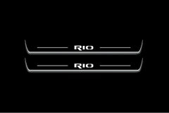Two long door sill plates with Rio lettering and edges illuminated in white, straight-on view on a dark background.
