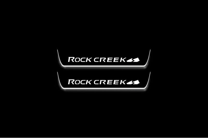 Nissan Rogue III T33 2021+ entry guards in stainless steel with Rock Creek logo