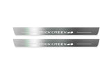 Nissan Rogue III T33 2021+ stainless steel LED door sill plates with Rock Creek logo